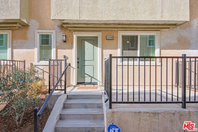 property entrance featuring covered porch