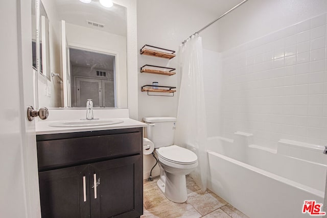 full bathroom featuring vanity, shower / bathtub combination with curtain, and toilet