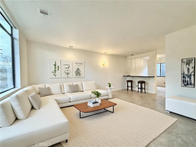 living room featuring light tile patterned floors