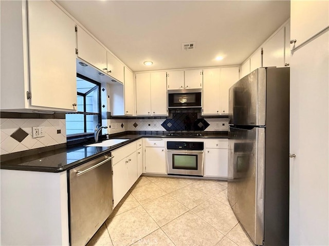 kitchen featuring white cabinetry and appliances with stainless steel finishes