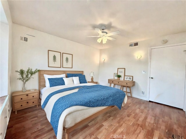 bedroom featuring hardwood / wood-style floors and ceiling fan