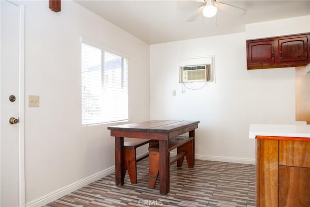 dining space featuring a wall mounted AC, hardwood / wood-style floors, and ceiling fan