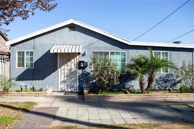 view of front of home with a patio area