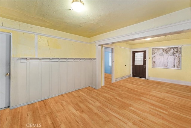 interior space featuring a textured ceiling and hardwood / wood-style flooring