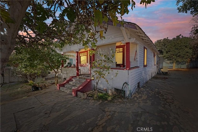 view of property exterior at dusk