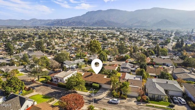 birds eye view of property featuring a mountain view