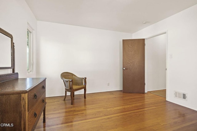 living area with wood-type flooring