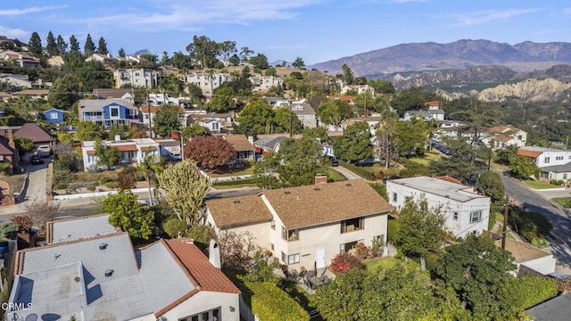 birds eye view of property featuring a mountain view