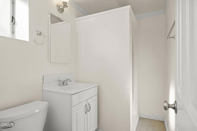 bathroom featuring crown molding, vanity, and toilet