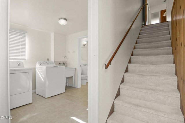 staircase featuring washer and dryer