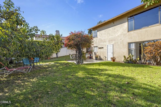 view of yard featuring a patio and fence