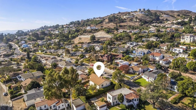 drone / aerial view featuring a residential view and a mountain view