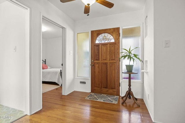 entrance foyer with light wood-type flooring and ceiling fan