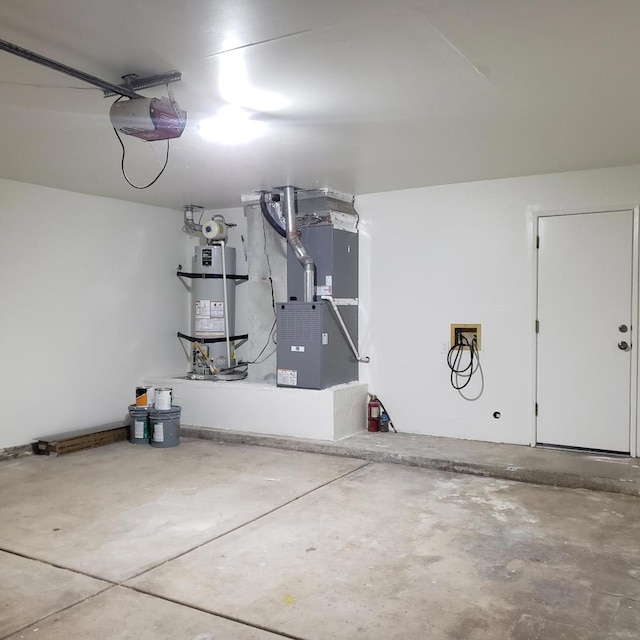 garage with heating unit, water heater, and a garage door opener