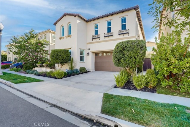 mediterranean / spanish-style house featuring a garage