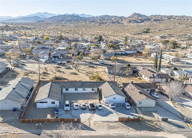 birds eye view of property featuring a mountain view