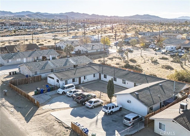 birds eye view of property featuring a mountain view