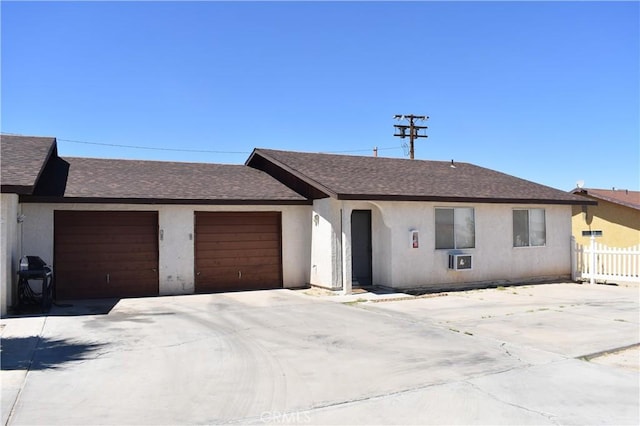 ranch-style home featuring a garage