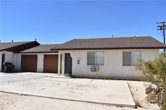 single story home featuring a garage