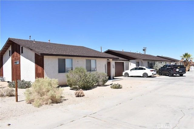 single story home with a garage