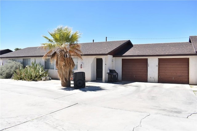 single story home featuring a garage