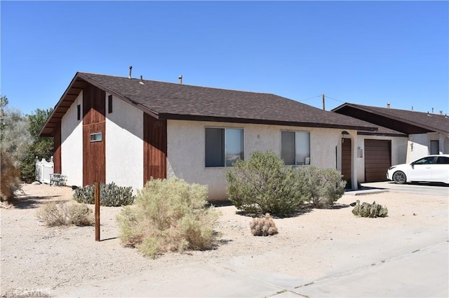 single story home featuring a garage