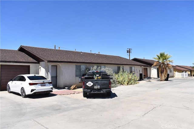 single story home with a garage