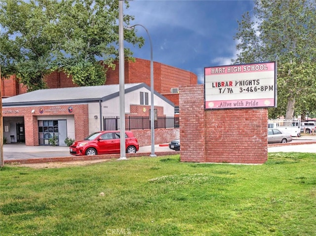 view of home's community with a lawn