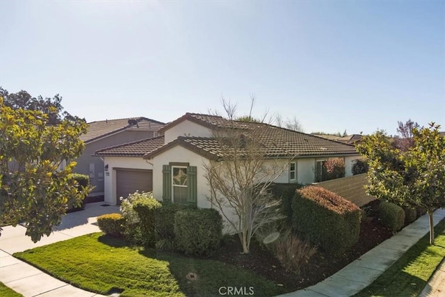 mediterranean / spanish house with a garage