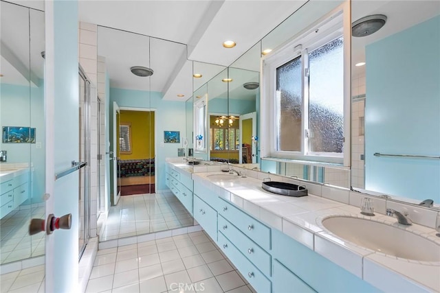 bathroom featuring tile patterned floors, vanity, and walk in shower