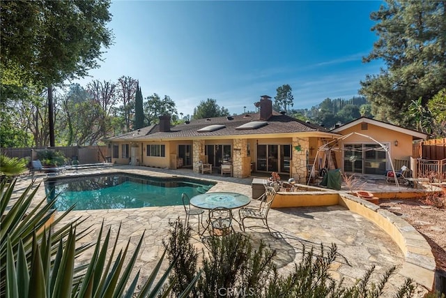 view of swimming pool with a patio area