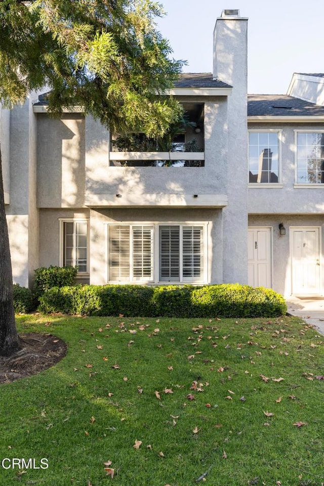 view of property with a front lawn