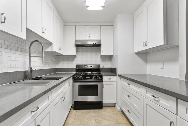 kitchen with white cabinets, gas stove, and sink