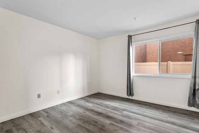 spare room with hardwood / wood-style flooring