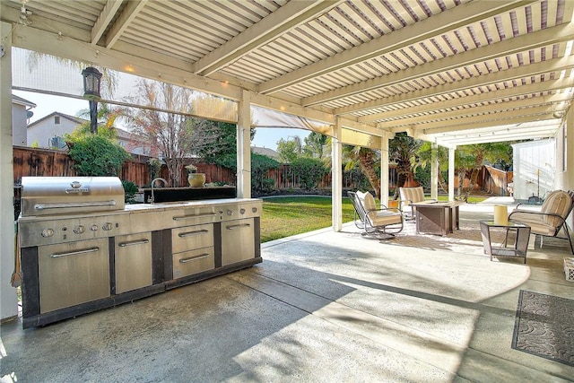 view of patio featuring a pergola, area for grilling, and an outdoor fire pit