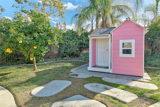 view of shed with fence