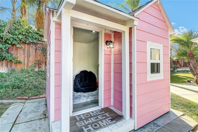 doorway to property with fence