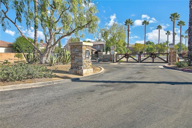 view of gate featuring fence