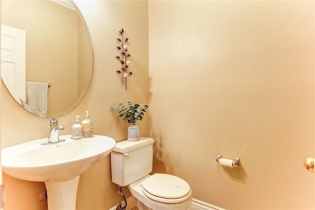 bathroom featuring sink and toilet