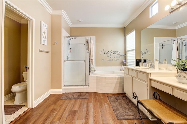 full bath featuring wood finished floors, toilet, ornamental molding, a shower stall, and a bath