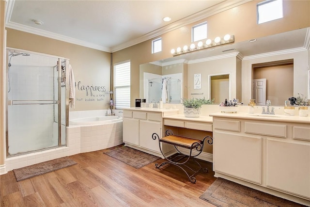 bathroom featuring vanity, hardwood / wood-style floors, ornamental molding, and separate shower and tub