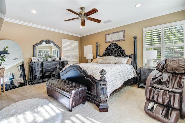 bedroom with visible vents, light carpet, and crown molding