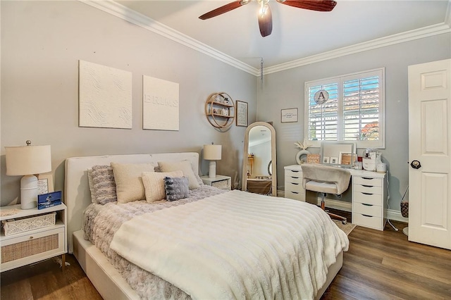 bedroom with dark wood-type flooring, ceiling fan, and ornamental molding