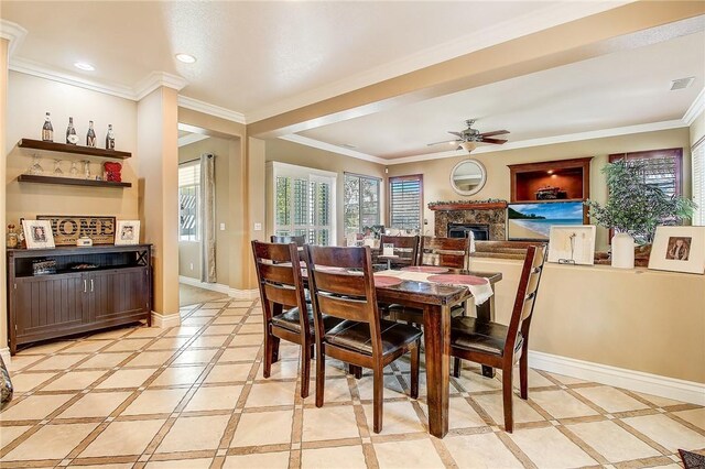 dining space featuring crown molding, ceiling fan, and indoor bar