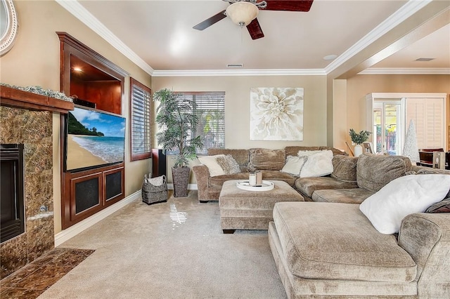 living room with ceiling fan, light colored carpet, visible vents, and ornamental molding