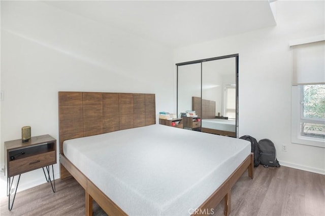 253 Fairview St, Laguna Beach, CA 92651 - bedroom with baseboards, wood finished floors, and a closet