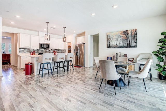 dining room with light hardwood / wood-style floors