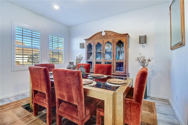 dining area featuring light wood-type flooring