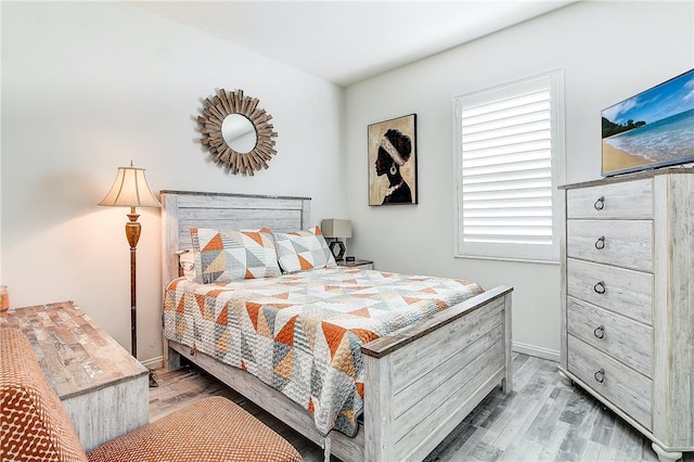 bedroom featuring hardwood / wood-style flooring