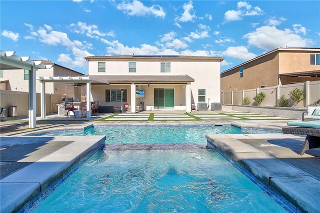 view of swimming pool featuring a patio area, ceiling fan, and pool water feature